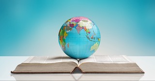 Globe on top of the Bible