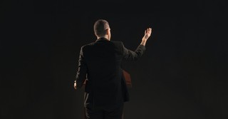 A man speaking at a podium