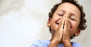 little boy praying happy