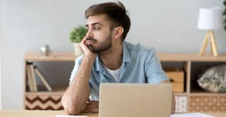 A man looking bored and unamused