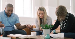 A group of people praying