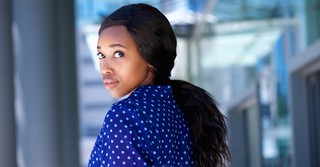 Woman looking back over her shoulder