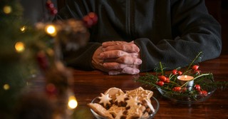 a man praying at Christmas