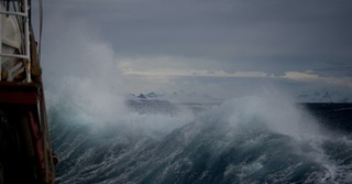 Boat in the middle of stormy seas