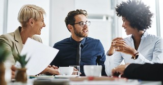 Men and women talking at work