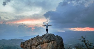 man on mountaintop, give thanks to the lord