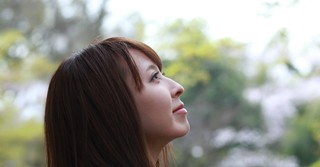 Woman looking up, peaceful