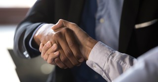 Two businessmen shaking hands