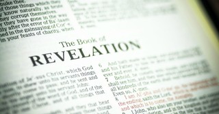 Close up of the book of Revelation, i am the alpha and the omega