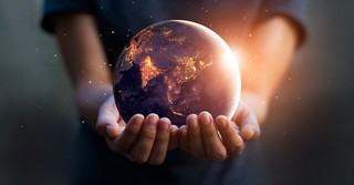 Person holding the world