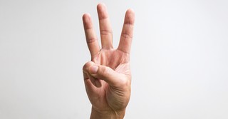 Three fingers held up