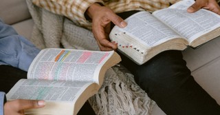 Two men studying the Bible together