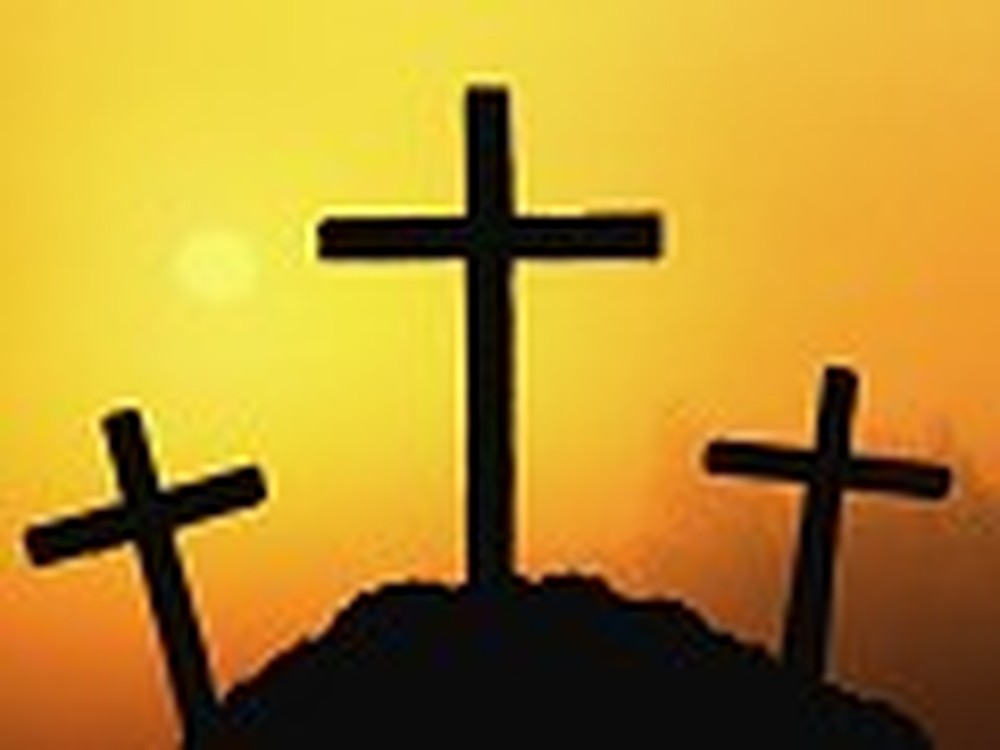 Three Crosses with an Orange Sky Background