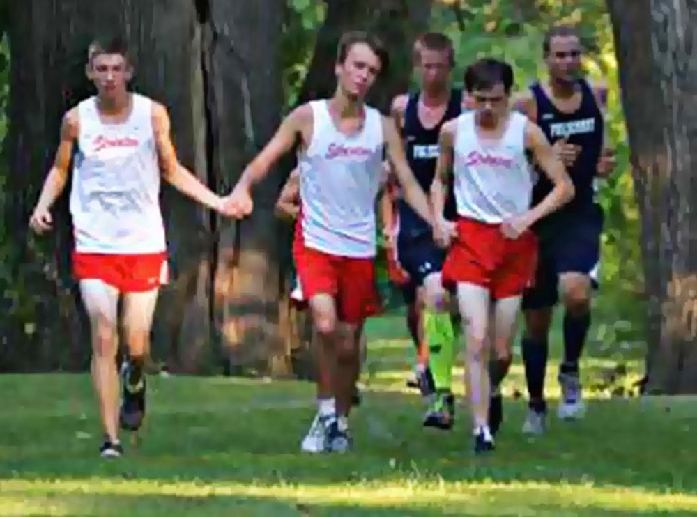High School Athletes Hold Hands With Fallen Runner - an Incredible Thing to See