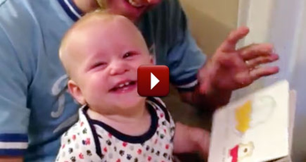 See How This Silly Baby Reacts to Reading a Book