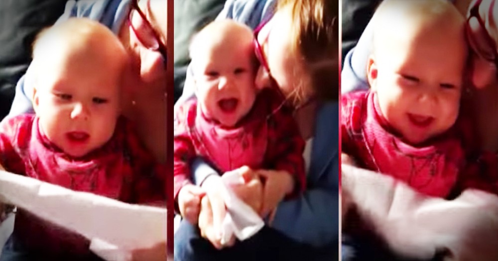 Just A Baby Hysterically Giggling At A Piece Of Paper 