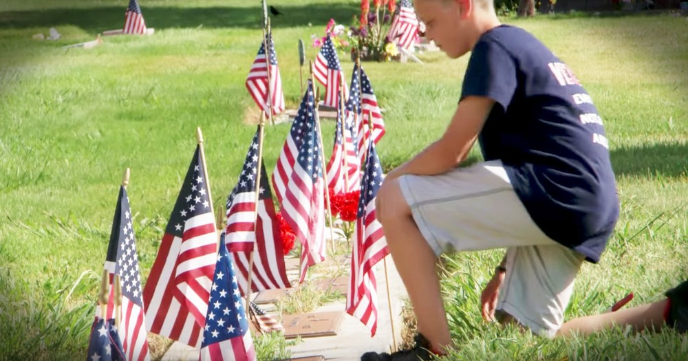 Patriotic Boy Puts Flags On Veteran's Graves
