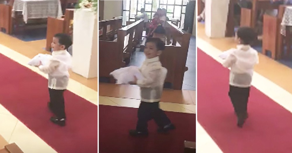 Ring Bearer Adorably Tosses His Pillow While Walking Down Aisle