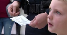 7-Year-Old Hands Out Lucky Pennies To Keep Police Officers Safe