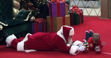 Caring Santa Gets Down on the Floor for a Boy with Autism and It Sends a Beautiful Message