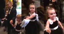 Hilarious Flower Girl Stops To Say Hi To Her Daddy
