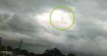 Woman's Footage From Storm Reveals Mysterious Figure Walking In The Clouds