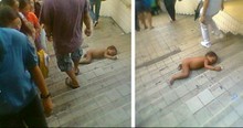 Heartbreaking Photo Of Naked Baby Curled On Busy Stairs