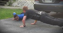Police Officer Gets Down In Driveway To Calm An Upset Boy With Autism