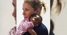 Photo Of Police Officer Comforting A Baby Goes Viral