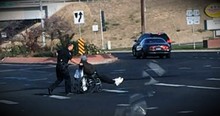 Officer Parks At Busy Intersection To Help A Man In A Wheelchair Cross