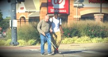 Teen Helps A Blind Man Cross A Busy Intersection