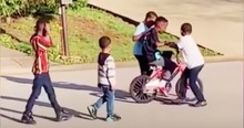 The Neighborhood Kids Help Boy Ride His Bike And It's A Reminder Of The Beauty Of Humanity