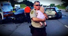 Police Officer Holds Baby Girl After Car Accident