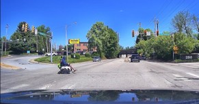 Electric Wheelchair In Philadelphia Traffic
