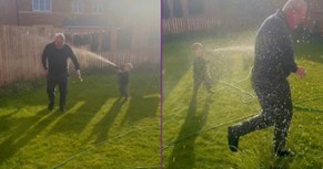 Toddler ‘Watering’ Grandad With the Hose
