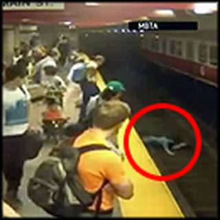 Woman and Child Fall on Train Tracks - But a Hero Saves the Day