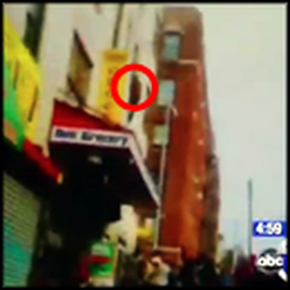 Man Jumps From a Burning Building and is Saved - Caught on Tape