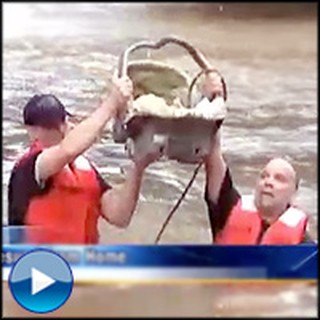 Sleeping Baby is Dramatic Rescued From Violent Flood Waters