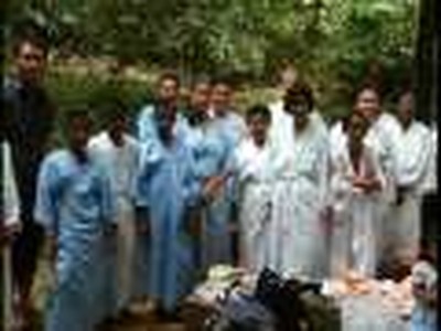 Baptism at waterfall