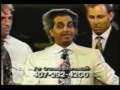 Benny Hinn falling to the ground