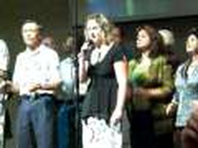 Melissa Maestas singing a solo at Praise AG