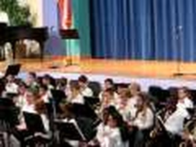 Josh Playing Trumpet in a School Program