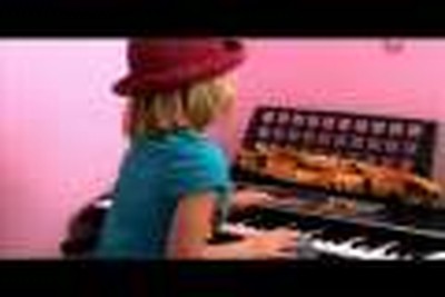 5 year old girl plays piano and flute