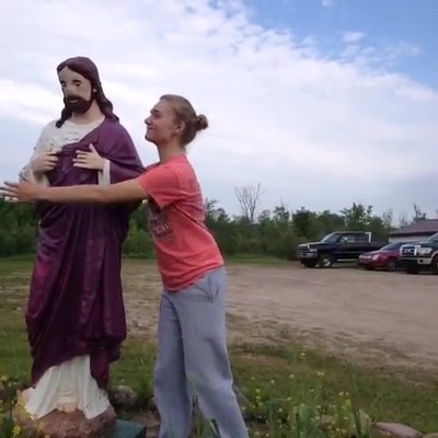 Teen Hugging Statue