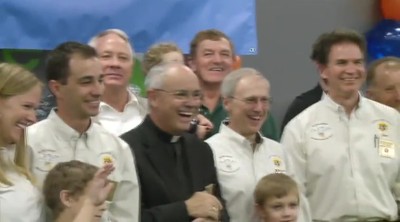 Knights of Columbus Help Denver Broncos Distribute Coats to Needy Children