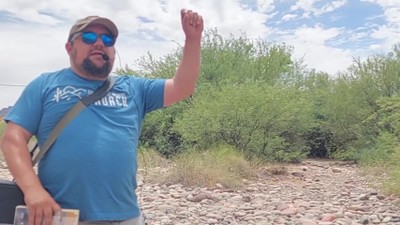 Street Preacher By The River Calling Out Sin And Pointing To Christ