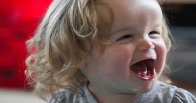 Mother Is Excited To See Her Daughter With A Genetic Disorder Running In The Yard