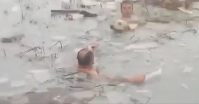 2 Police Officers Spot A Dog In Trouble And Jump In For Tense Frozen Lake Rescue