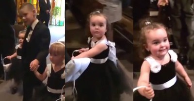 Hilarious Flower Girl Stops To Say Hi To Her Daddy
