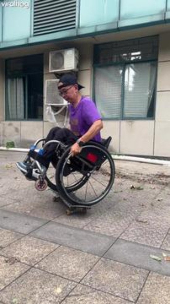 Talented Man Rides a Skateboard While in a Wheelchair0